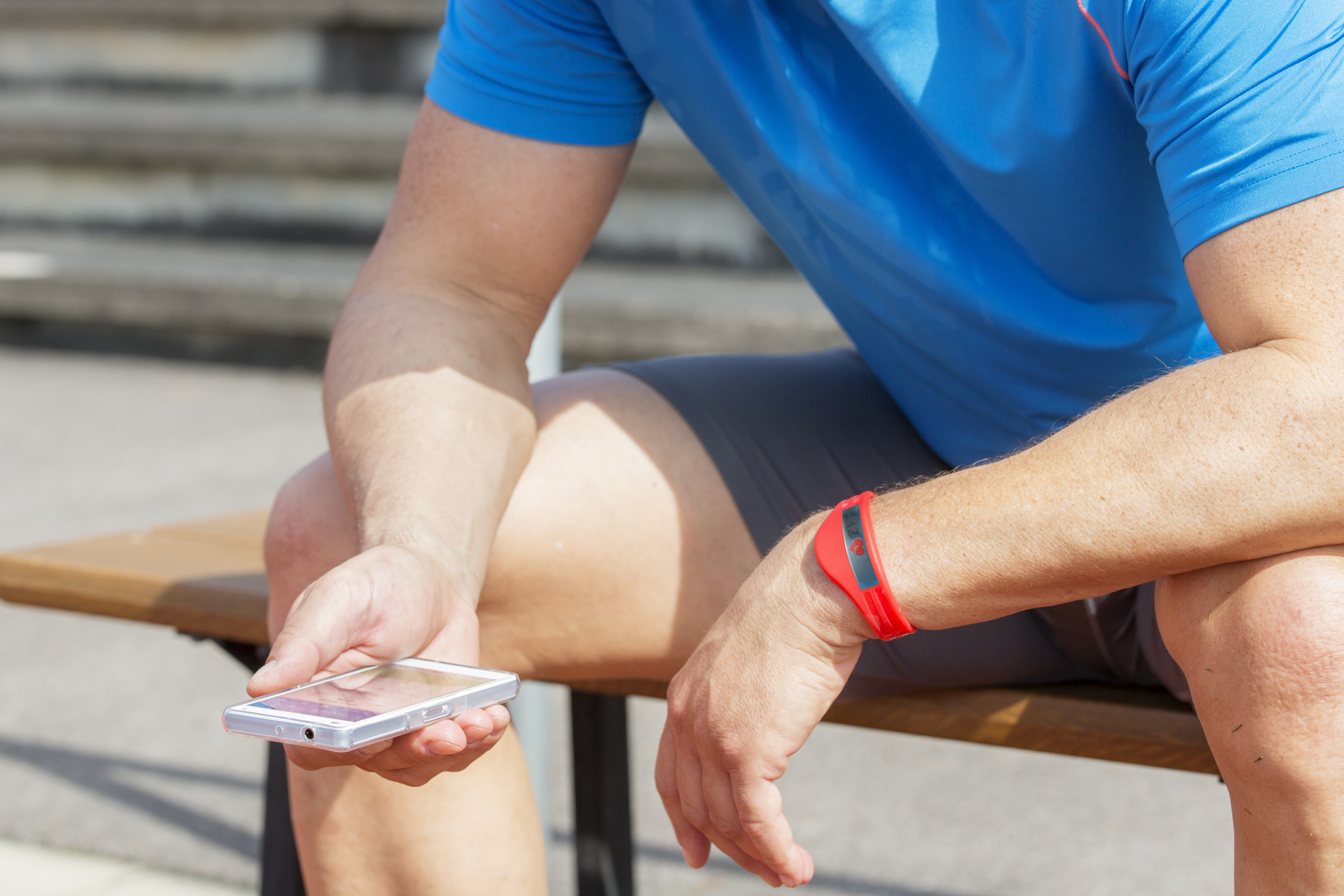 Athlete sitting down checking their phone