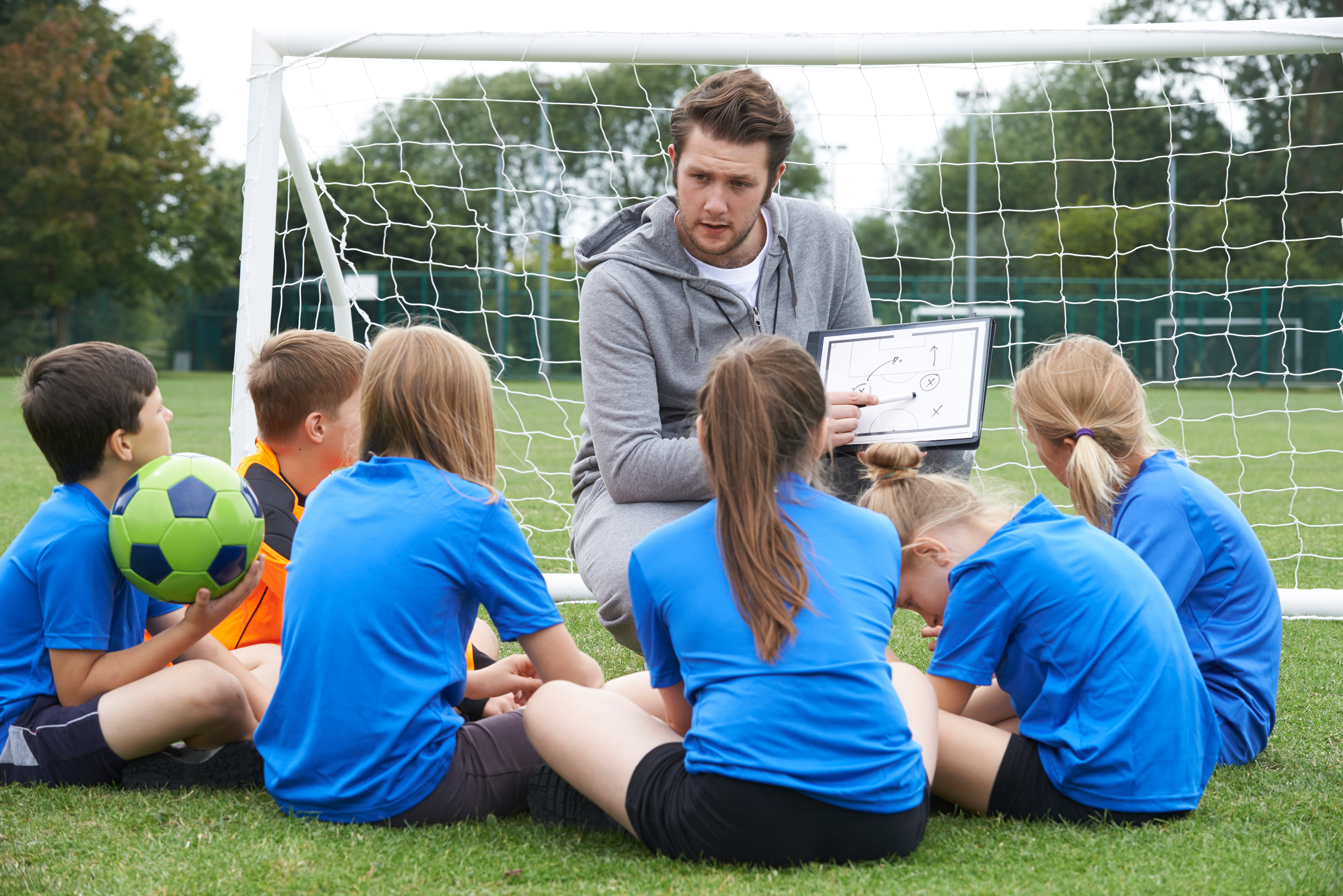 Children listening to their coach