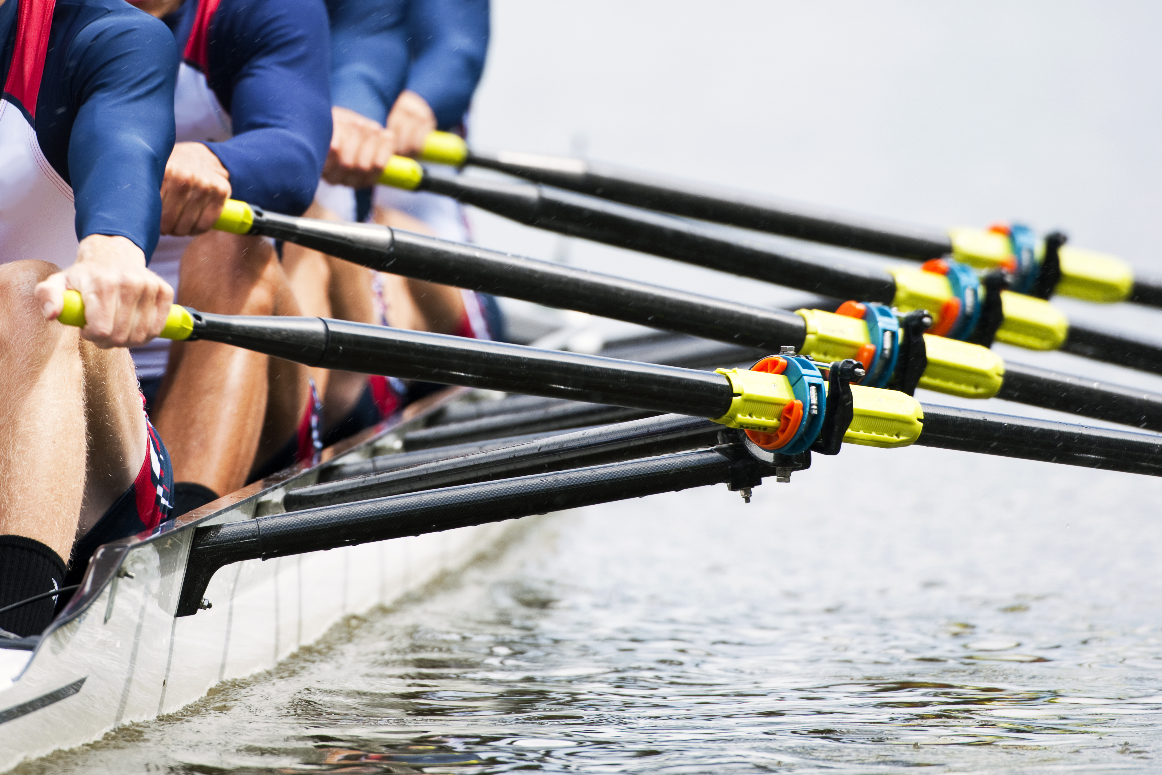 People rowing in a lake