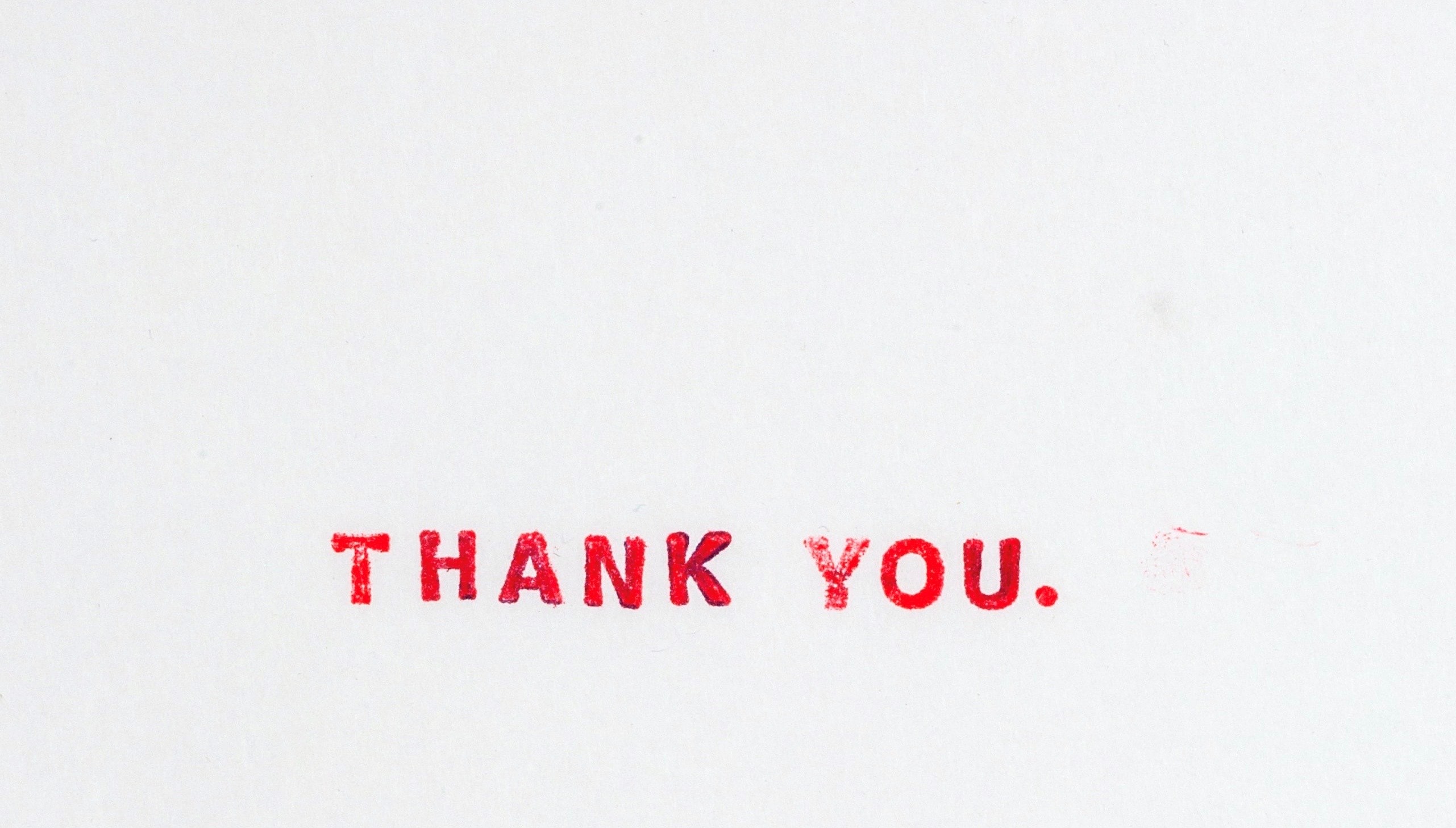 The words 'Thank You' in red font against a grey background