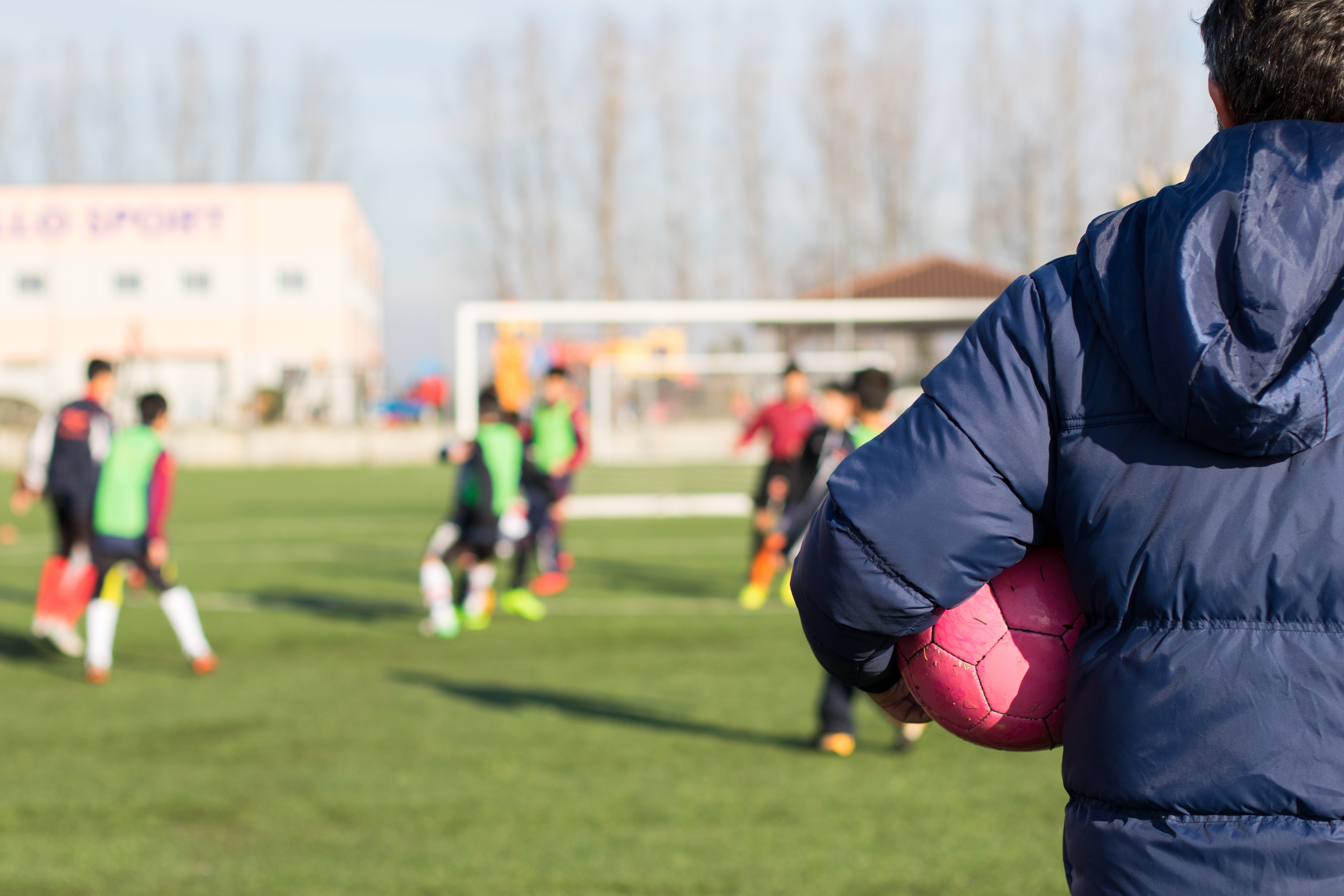 Coach watching a game of football