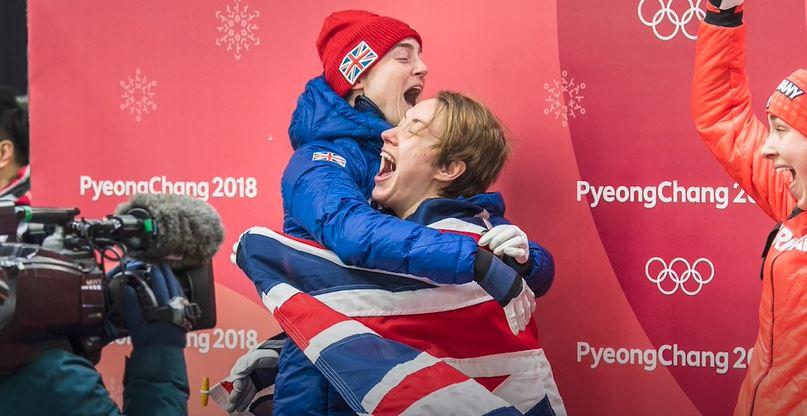 UKAD Athlete Commission Member, Laura Deas and her teammate hugging in celebration