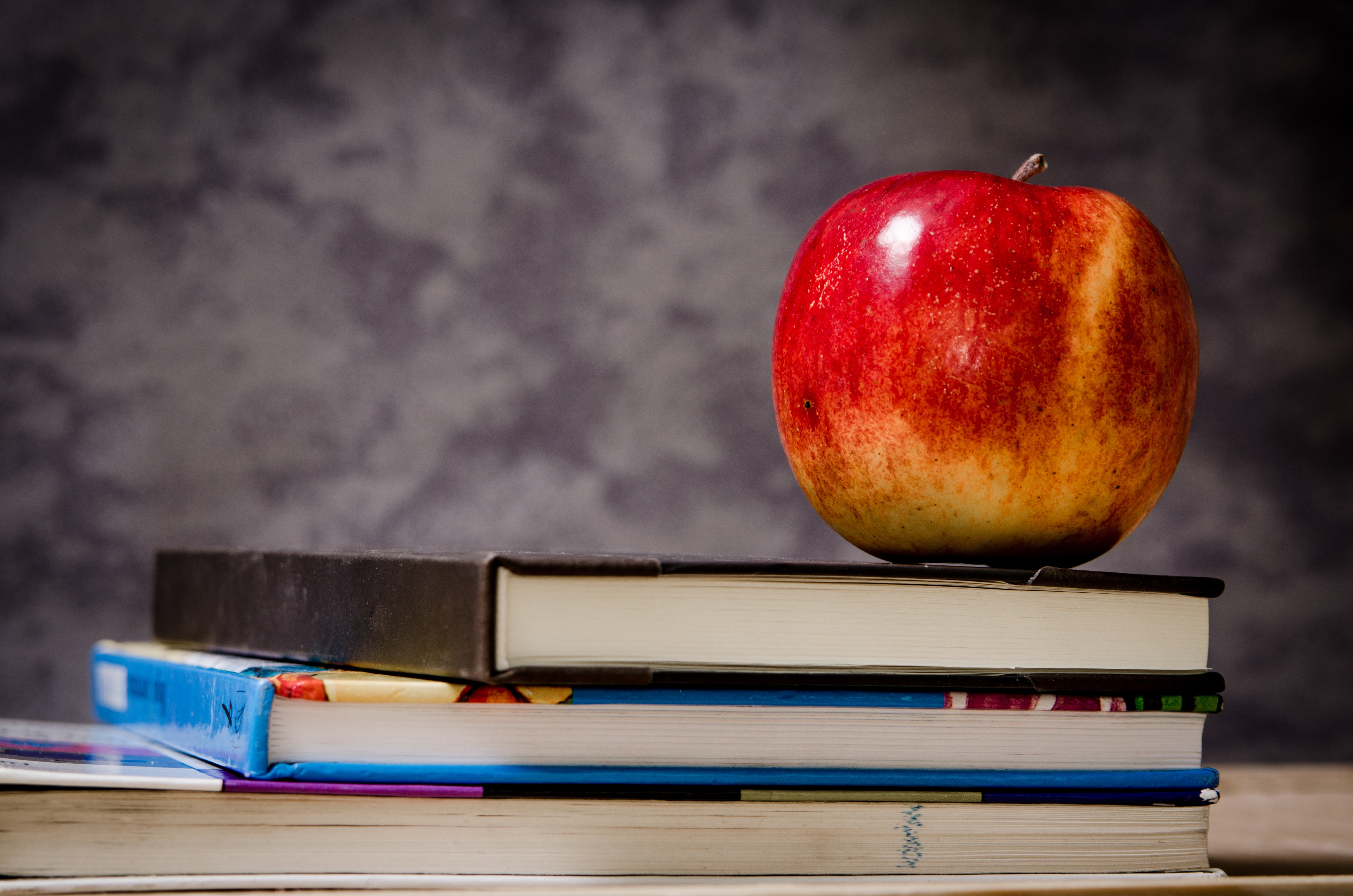 Books and an apple