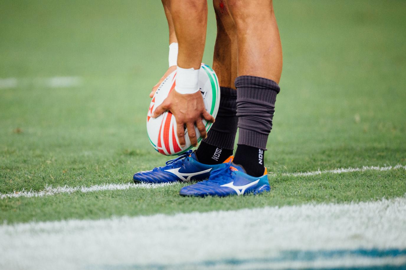 Rugby player placing ball on the ground
