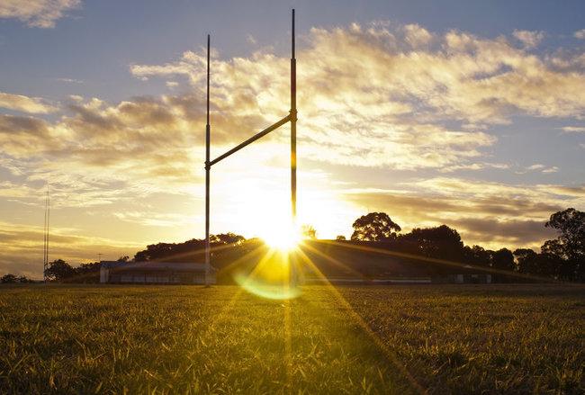 Rugby goal post in sunset