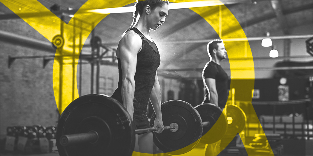 Female weightlifter lifting a heavy weight