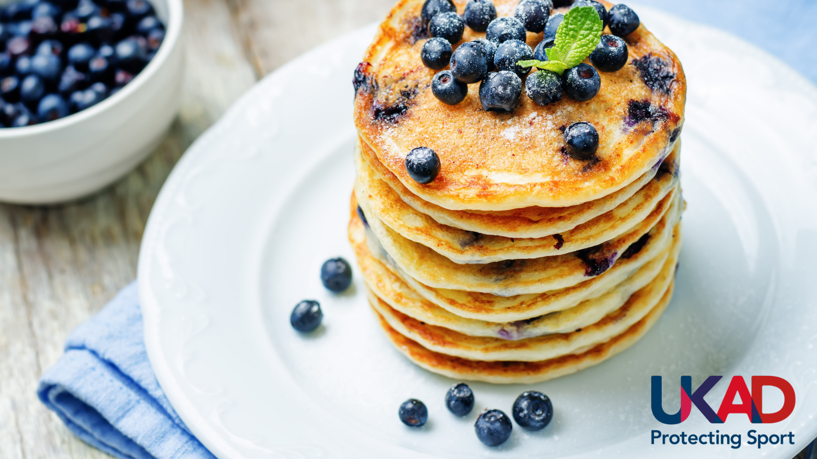 Stack of pancakes with UKAD logo in bottom right corner